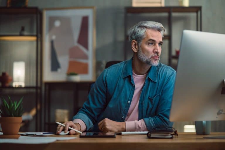 Man working at a computer in a home office